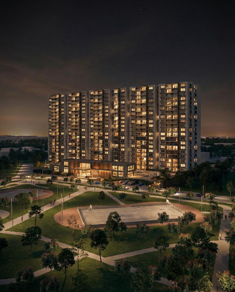 Torre residencial iluminada de noche con identidad de marca